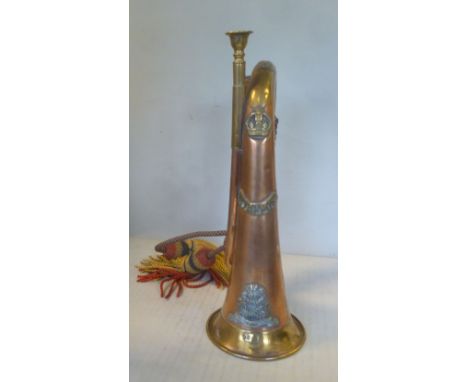 A copper and brass bugle, bears the emblem of the North Stafford regiment, EG, impressed WD and 4627 Bugler F Aregot with a t