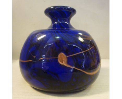 An Art Glass opaque dark blue and black vase of squat, oval, bulbous form with a narrow neck, flared rim and overlaid, random