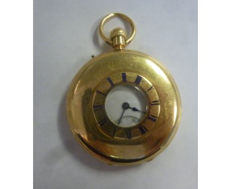 A mid Victorian (1862) 18ct gold cased half hunter pocket watch with engraved enamelled blue Roman numerals around the window