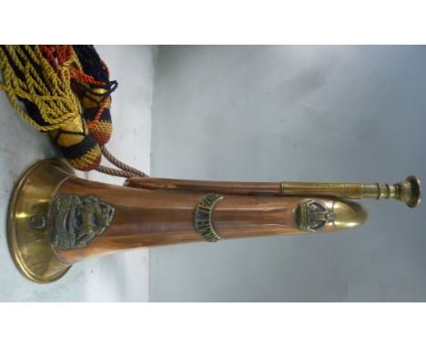 A copper and brass bugle, bears the emblem of the Royal Berkshire regiment, AT, impressed WD R Berks and 6600 Bugler A Tinsle