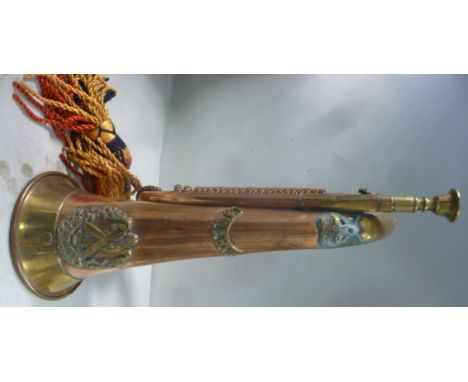 A copper and brass bugle, bears the emblem of The Cameron Highlanders regiment, AN impressed CH WD and 8280 Bugler A Nelson w