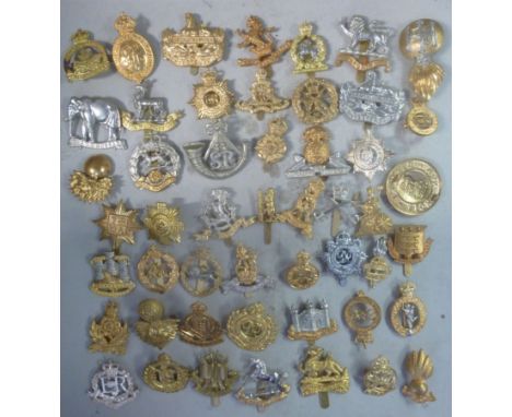 A collection of mainly British military cap badges (many copies): to include The Royal Hampshire, The Lancashire Fusiliers an