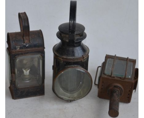 Three vintage railway lamps to include a BR(M) railwayman's lamp with slatted red, green and blue glass panels and 2 others w