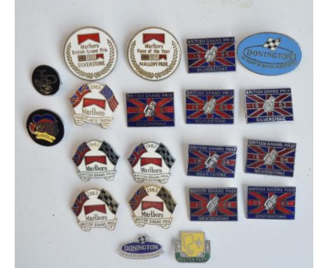 Twenty mostly motorbike racing related enamel pin badges to include The British Grand Prix Silverstone, Marlboro GP badges, D