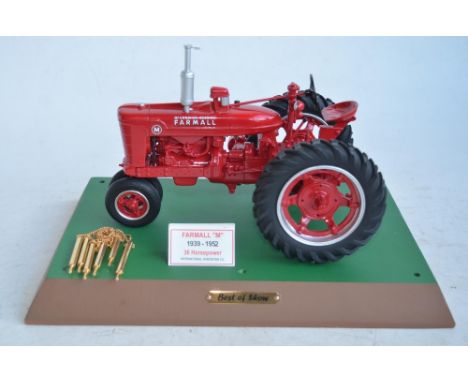 Speccast 1/16 scale resin and metal International Harvester Farmall "M" tractor model with base and chain link surround. Base