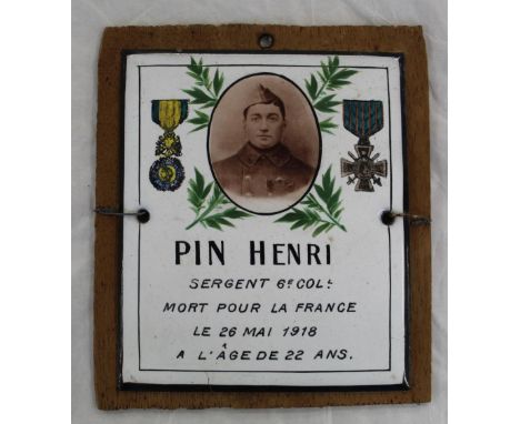 French WWI enamel memorial plaque with photograph of Sgt  Henri Pin with dates and painted medals. with wood backing.  11cmx1