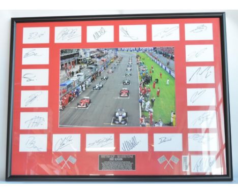 Large framed collection of 21 Formula 1 drivers autographs from The British Grand Prix, Silverstone 2003. Signatories include