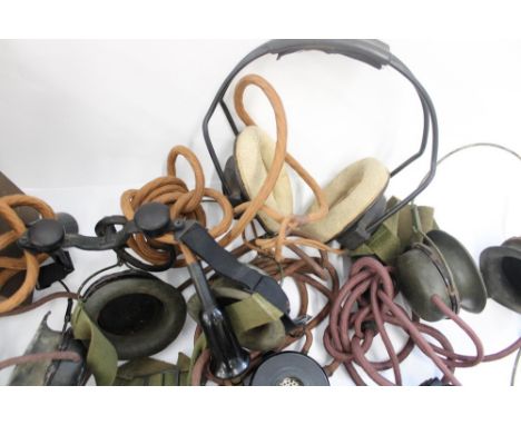 Collection of WWII period military radio and operators headsets and speaker handsets incl. ZA 21514 headgear assembly, Air Mi