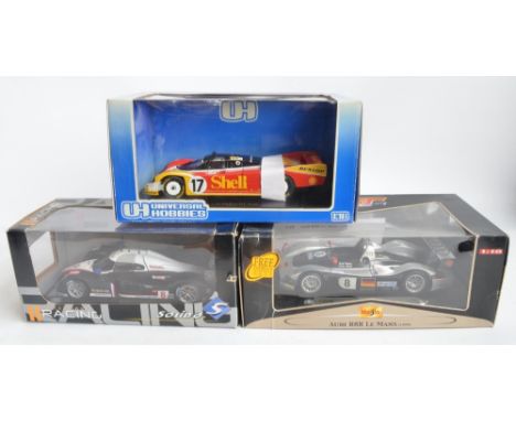 Three boxed 1/18 scale highly detailed diecast car models to include Solido Racing Collection Peugeot 908 "LMS" 2007 (118 004