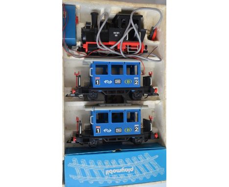 Boxed Playmobil Art Nr 4000 electric steam train model. Contents in excellent condition, some blue paint/ink on one passenger