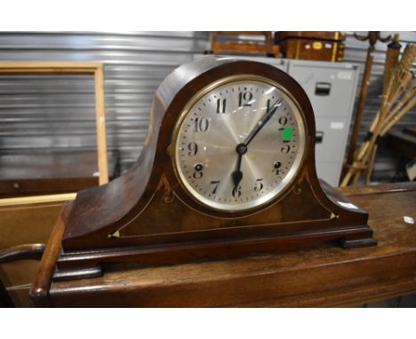 An early 20th Century mahogany mantel clock in napoleon style
