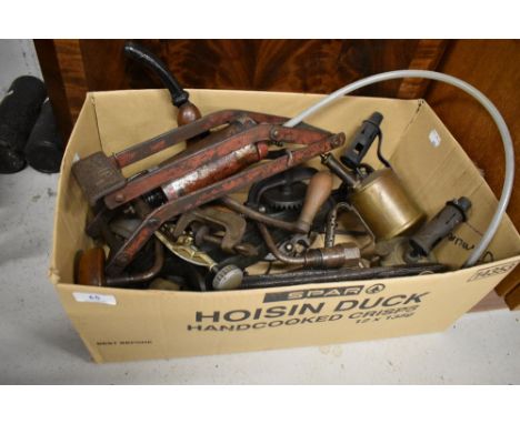 A selection of antique and later hardware tools including yard measure, pillar drill and burners