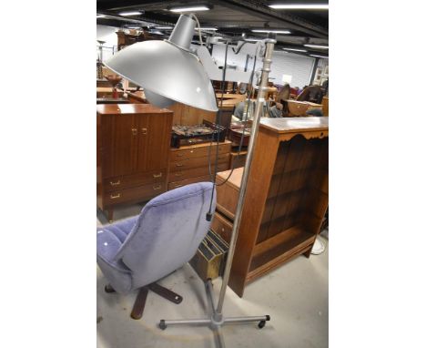 A modern photography lamp having large shade and movable base