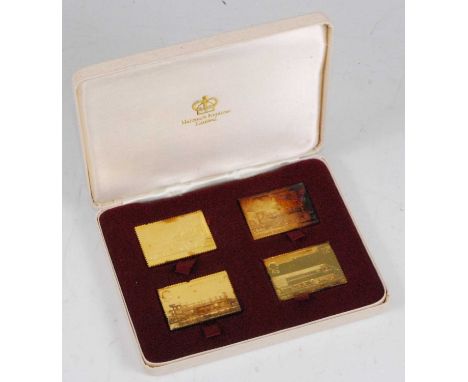 A Hallmark Replicas Ltd. cased set of four gold plated on silver Passenger Railway 150th Anniversary 1825-1975 stamp replicas