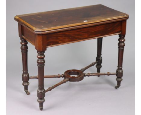 A 19th century mahogany card table inset green baize to the rectangular fold-over top, on four turned legs &amp; ceramic cast