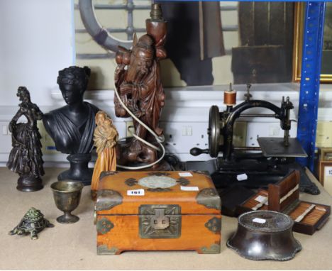 A 19th Century sewing machine; a carved wood “sage” table lamp; a cast-metal bust; a trinket box; &amp; sundry other items.