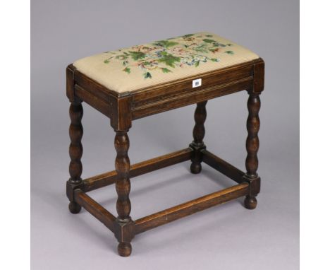 A 1930’s oak stool with a padded drop-in-seat, &amp; on bobbin-turned legs &amp; turned feet with plain stretchers, 20¾” wide