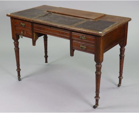 An Edwardian mahogany knee-hole writing desk inset leather to the sliding top, fitted with an arrangement of four drawers &am