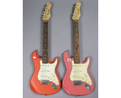Two Stagg six-string electric guitars.