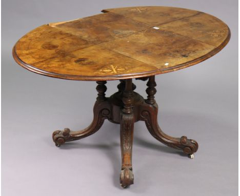 A 19th century inlaid-walnut oval drop-leaf dining table (w.a.f), on four turned supports &amp; carved splay legs with cerami