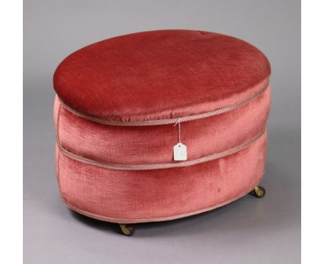 A mid-20th century oval stool upholstered pink velour, &amp; on ceramic castors, 23” wide x 15¾” high.