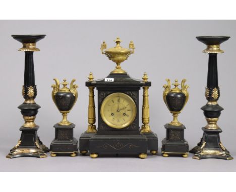 A 19th century mantel clock with a striking movement, having black Roman numerals to the brass dial, &amp; in a black slate c