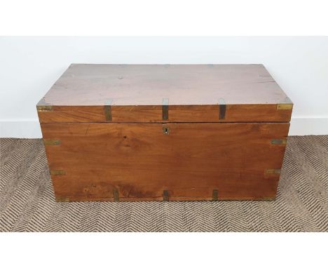 TRUNK, 19th century teak, with brass detail, a rising lid and end handles, 99cm W x 54cm D x 48cm H.