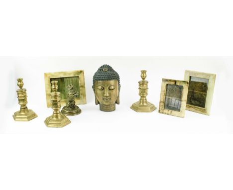 CHINESE BRONZE BUDDHA HEAD, character marks to the underside, a set of three brass candlesticks, three various onyx photo fra