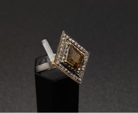 A SILVER GILT KITE SHAPED DRESS RING set with a single tourmaline surrounded by a border of rose cut diamonds, ring size N, c