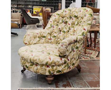 ARMCHAIR, Victorian with deep buttoned botanical print upholstery and turned front supports.