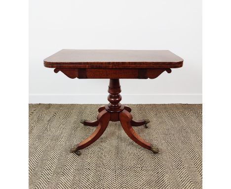 CARD TABLE, Regency mahogany on a turned column and quadraform supports on castors, 92cm W x 45cm D x 75cm H.