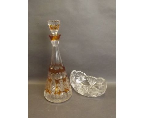 A C19th Bohemian cut amber overlaid glass decanter, and an oval cut glass bowl, 13½'' high 