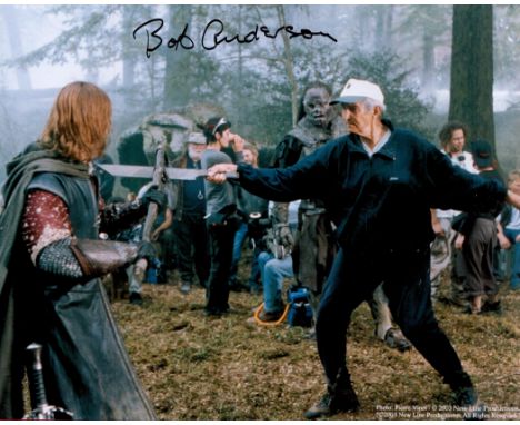 Bob Anderson Handsigned 10x8 Colour Photo of himself practicing sword fighting during a film set. Signed in black marker pen.