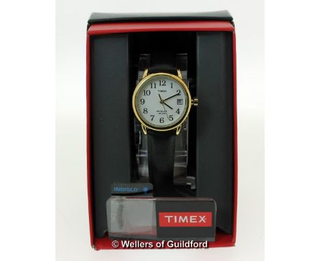 *Ladies' Timex wristwatch, circular white dial with Arabic numerals and date aperture, on a black leather strap, boxed (Lot s