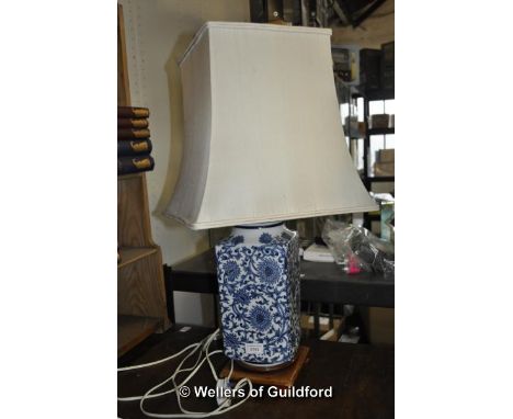 Pair of blue and white lamp bases with cream shades