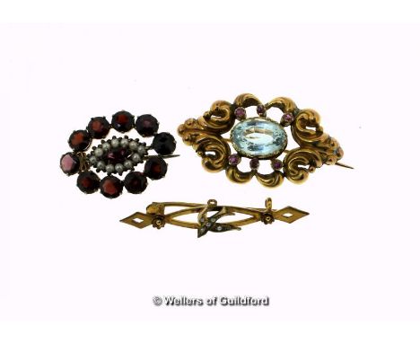 Bar brooch with a bird set with seed pearls, in yellow metal stamped 9ct, together with a blue topaz and ruby brooch, and a g