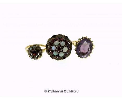 Ruby and opal cluster ring, mounted in yellow metal stamped 14ct, ring size L½, a 9ct gold amethyst ring, ring size R, and a 