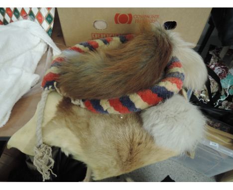 A vintage ecclesiastical style bell pull and selection of fox and similar furs