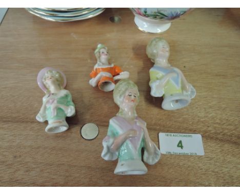 A selection of vintage ceramic figural pin cushion tops&nbsp;