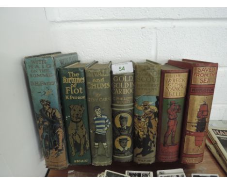 A vintage oak book trough with decorative book selection