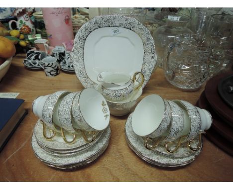 A vintage part tea service with white and gilt glaze