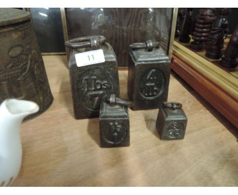 A set of vintage graduated cast kitchen scale weights