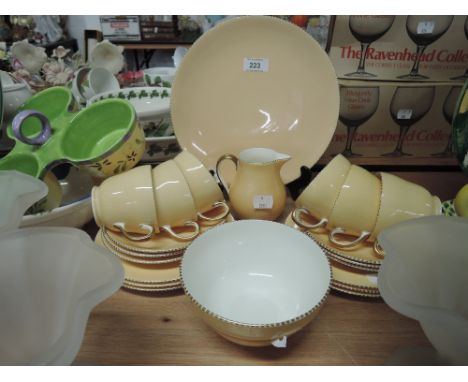 A vintage part tea service by Wedgwood with peach and gold glaze rd no. 5155no visible faults or repairs