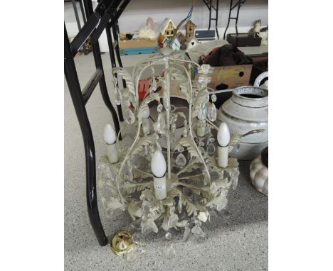 A floral decorated light fitting with glass lustre droplets