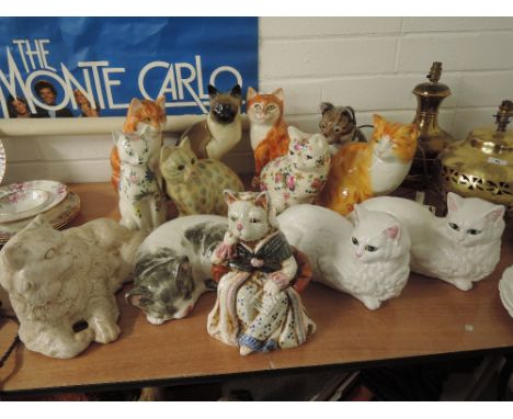 A selection of vintage ceramic cat figures including Tabby cat, Ginger, Siamese etc