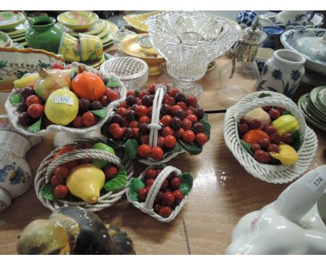 A selection of ceramic fruit bowls and similar decorations 