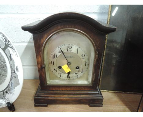 An early 20th century oak cased mantle clock with chime by W Greenwood of Leeds Huddersfield 