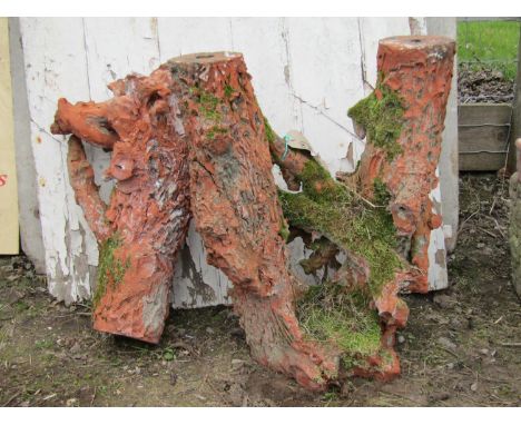 A Victorian terracotta stand naturalistically formed as a divided tree trunk and another separate similar piece 