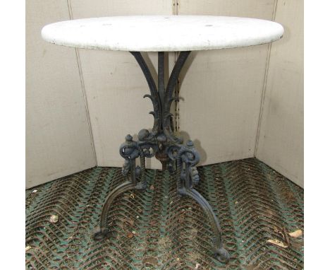 A Victorian cast iron and marble occasional table, the tripod base with decorative detail, 57cm diameter 