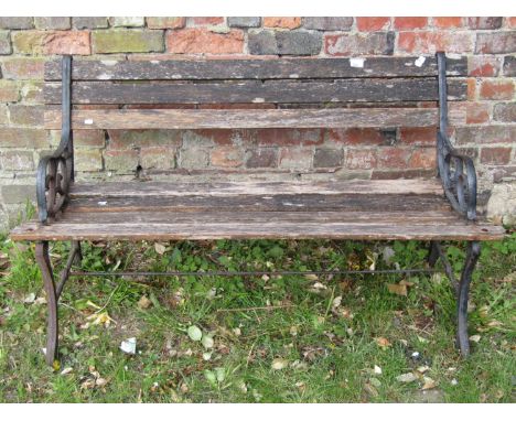 A small ironwork and teak garden bench, 122cm max 